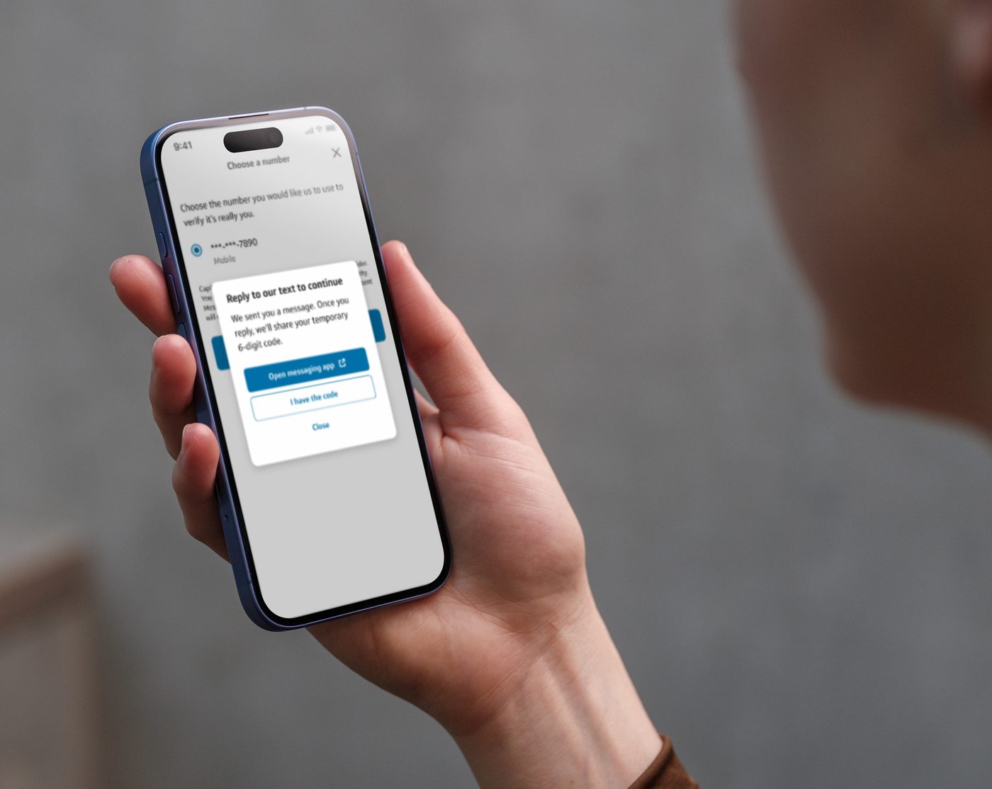 The iOTP interactive verification flow on a phone screen